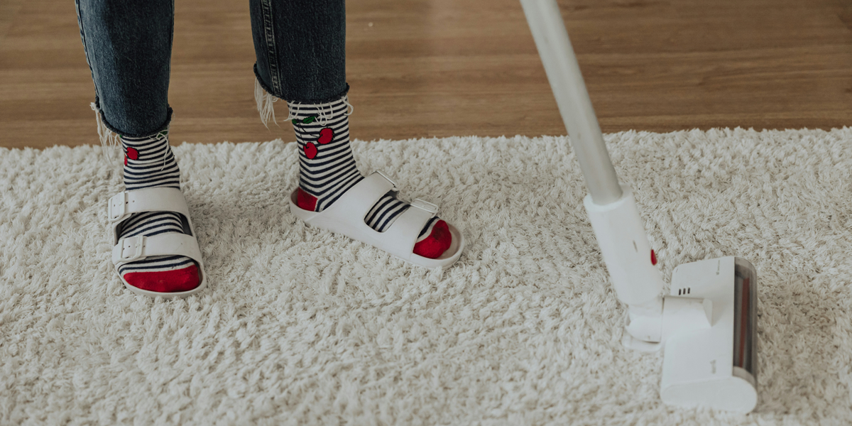 Image commercially licensed from: https://unsplash.com/photos/a-person-standing-on-a-carpet-with-a-mop--QJiSGVElWA