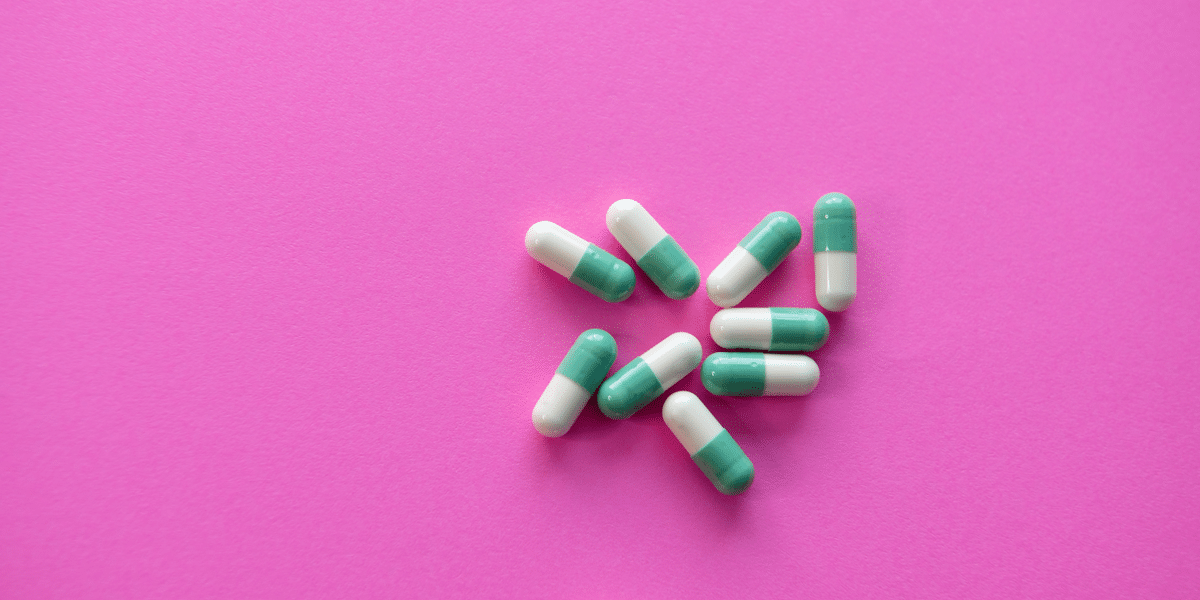 Image commercially licensed from: https://unsplash.com/photos/white-and-blue-medication-pill-on-pink-textile-WHSnkIwWpec