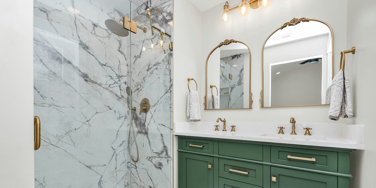 Image commercially licensed from: https://unsplash.com/photos/a-bathroom-with-green-cabinets-and-a-marble-shower-FiKcg6EMneY