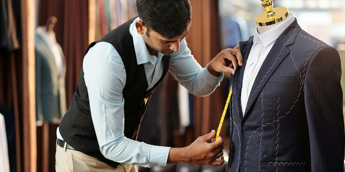 Image commercially licensed from: https://unsplash.com/photos/creative-young-tailor-measuring-bespoke-jacket-on-mannequin-he-is-working-on-wUhuzbQd1JU
